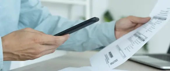 A finance professional reviewing aligned account statements